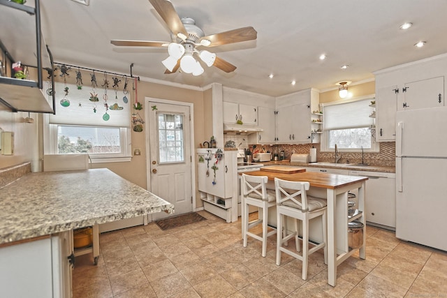 kitchen featuring under cabinet range hood, white appliances, ornamental molding, backsplash, and open shelves