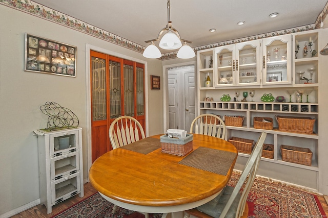 dining space featuring dark wood-style flooring