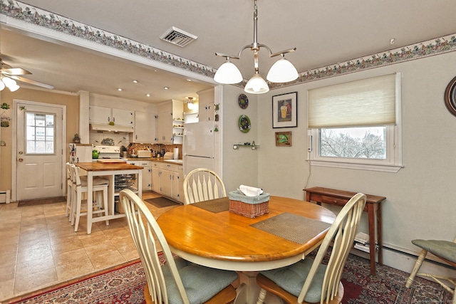 dining area with light tile patterned flooring, visible vents, and ceiling fan with notable chandelier