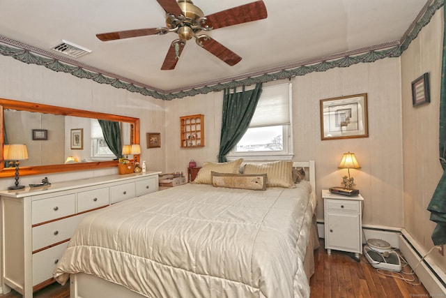 bedroom featuring ceiling fan, a baseboard radiator, dark wood-type flooring, visible vents, and crown molding