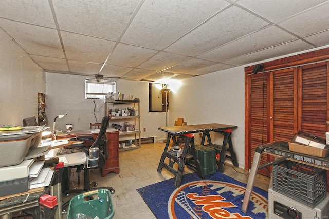 home office with a paneled ceiling and tile patterned floors