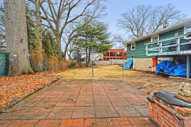 view of patio featuring fence