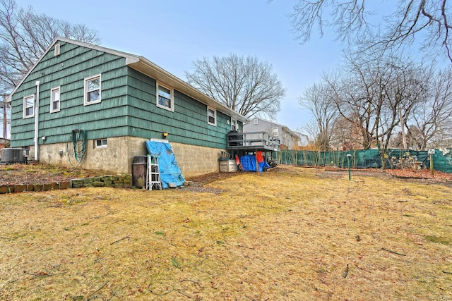 exterior space featuring cooling unit and fence