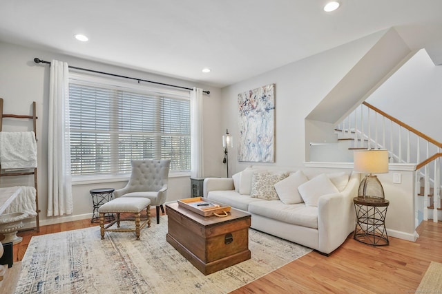 living room with baseboards, stairway, wood finished floors, and recessed lighting