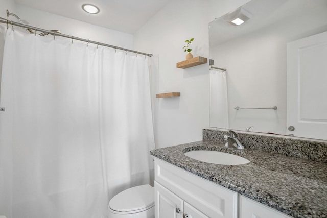 full bathroom with toilet, a shower with shower curtain, and vanity