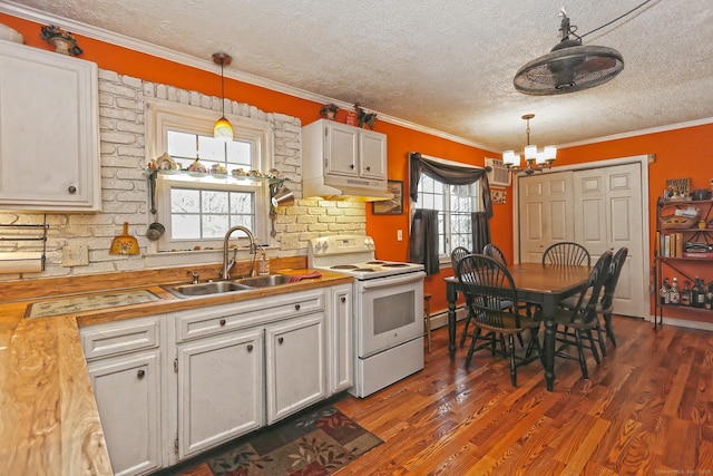 kitchen featuring dark wood-type flooring, a notable chandelier, white electric range, a sink, and white cabinets