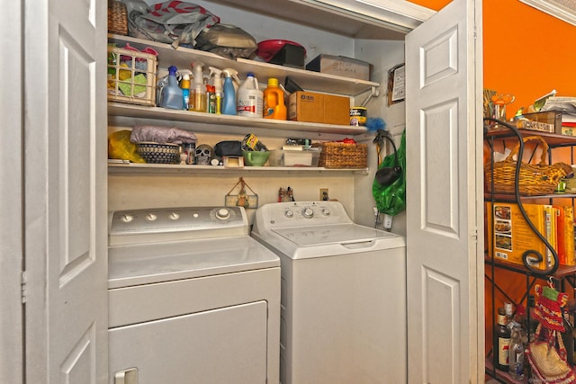 clothes washing area featuring independent washer and dryer and laundry area