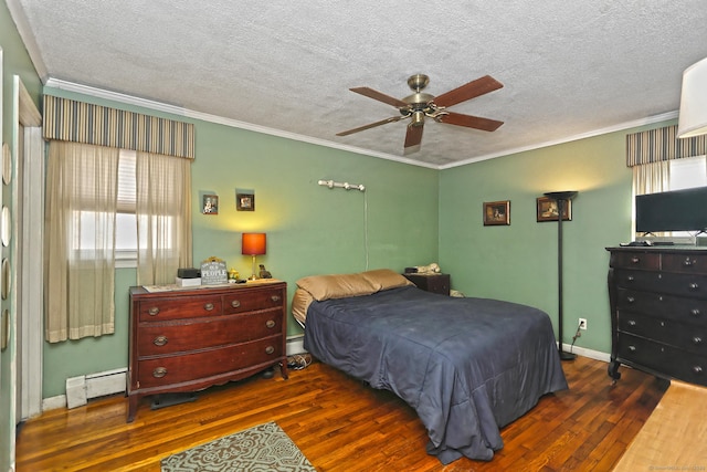 bedroom featuring ornamental molding, a baseboard heating unit, a textured ceiling, hardwood / wood-style floors, and a baseboard radiator