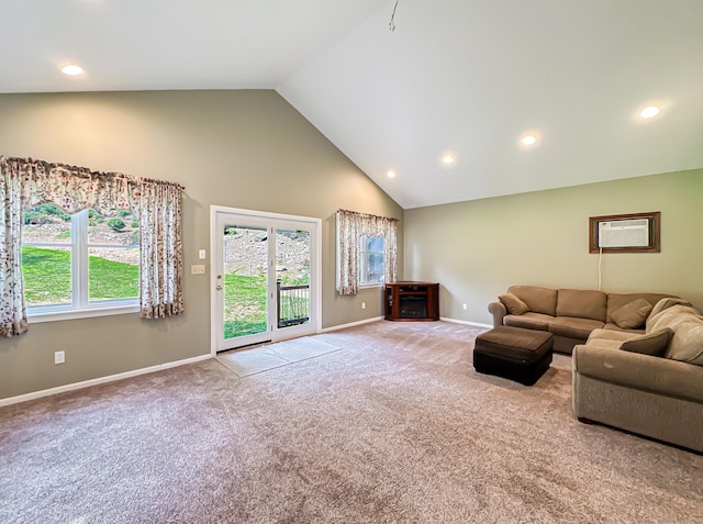 unfurnished living room featuring a wealth of natural light, baseboards, carpet, and a wall mounted AC