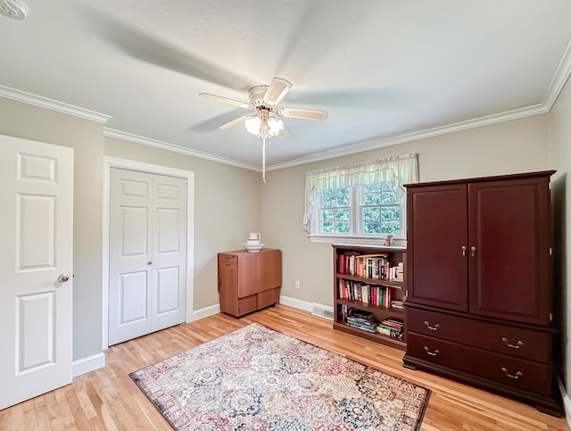 interior space featuring ornamental molding, visible vents, light wood-style flooring, and baseboards