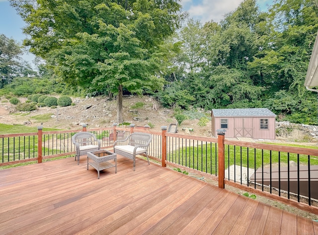 wooden terrace featuring an outbuilding and a storage unit