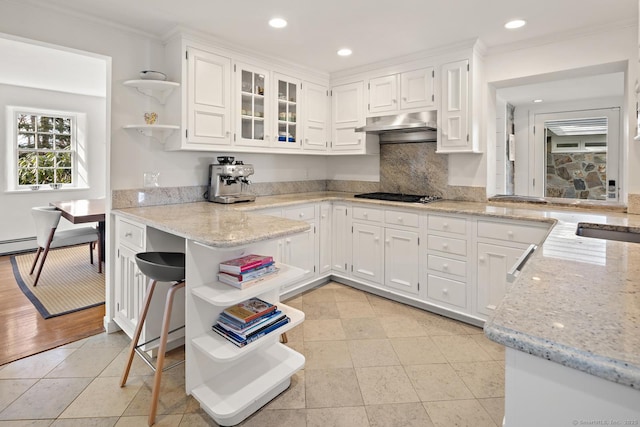 kitchen featuring black gas cooktop, under cabinet range hood, white cabinets, light stone countertops, and open shelves