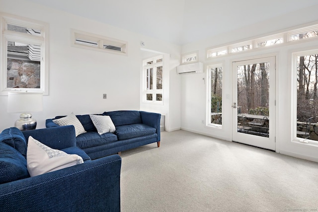 living area with carpet, baseboards, and a wall mounted AC