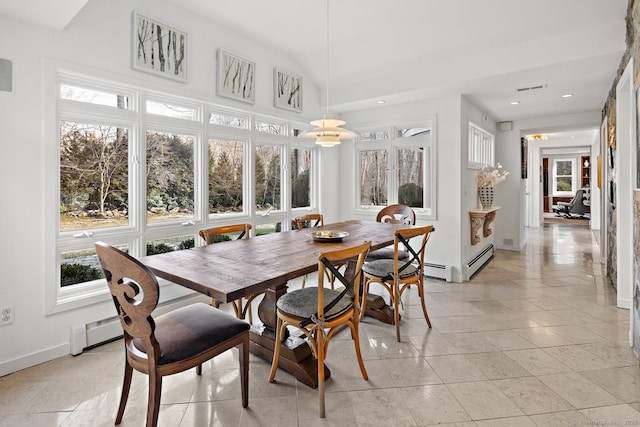 sunroom / solarium featuring a baseboard heating unit, lofted ceiling, and visible vents