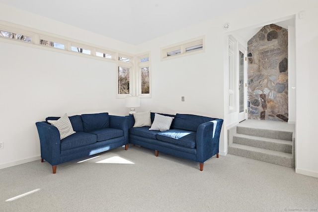 living room featuring carpet flooring and baseboards