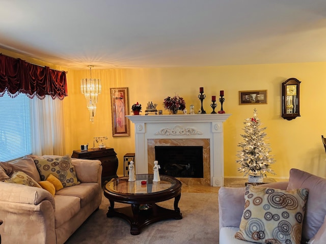 living room featuring a chandelier and a high end fireplace