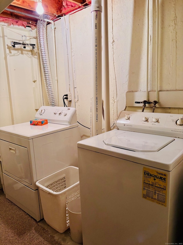 clothes washing area with washing machine and dryer and laundry area