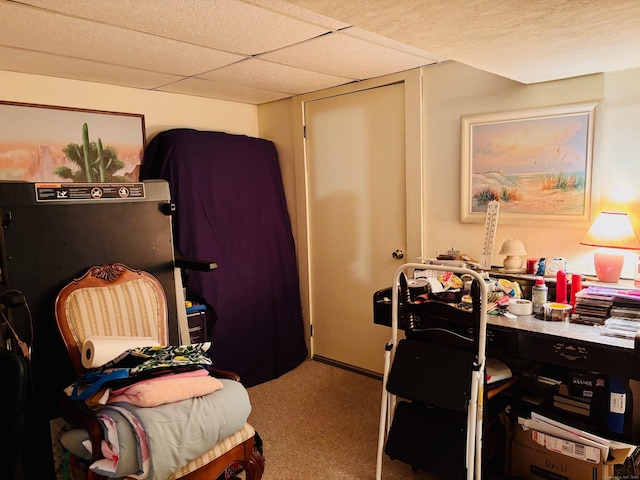 carpeted bedroom featuring a paneled ceiling