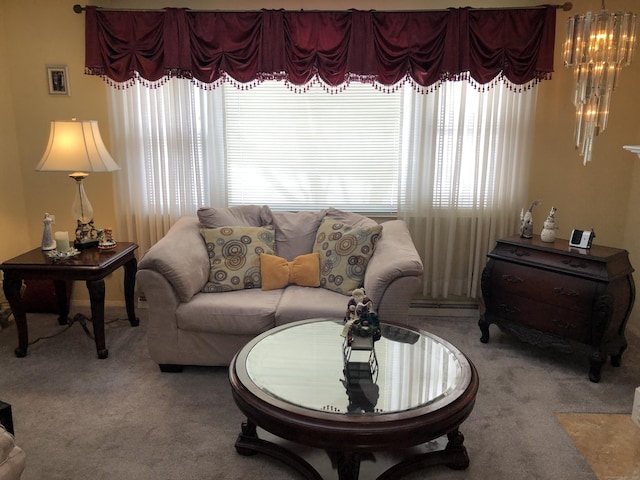 living area featuring carpet floors, a baseboard radiator, and a healthy amount of sunlight