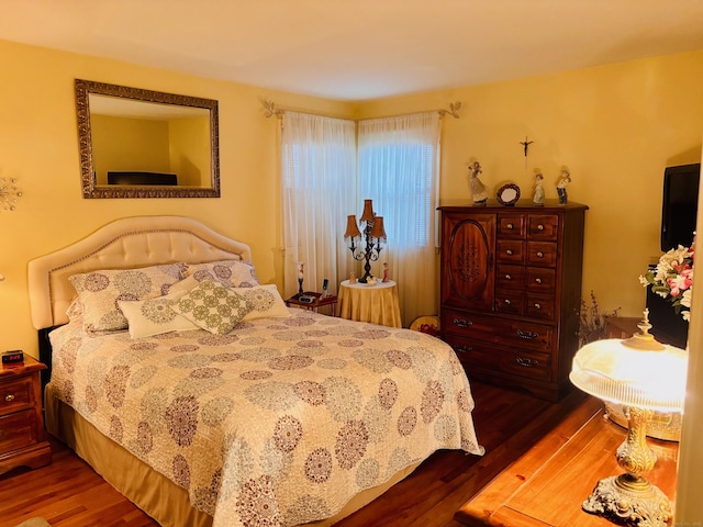 bedroom featuring wood finished floors