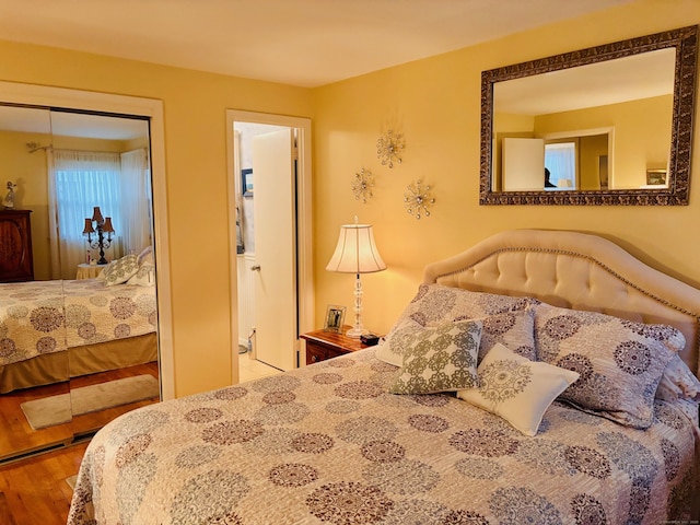 bedroom featuring a closet and wood finished floors