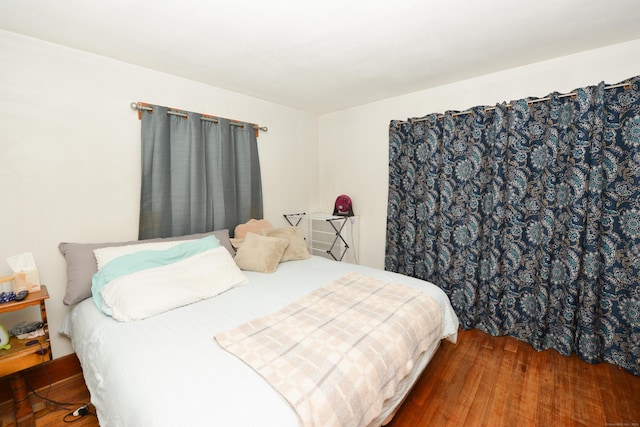 bedroom featuring wood finished floors