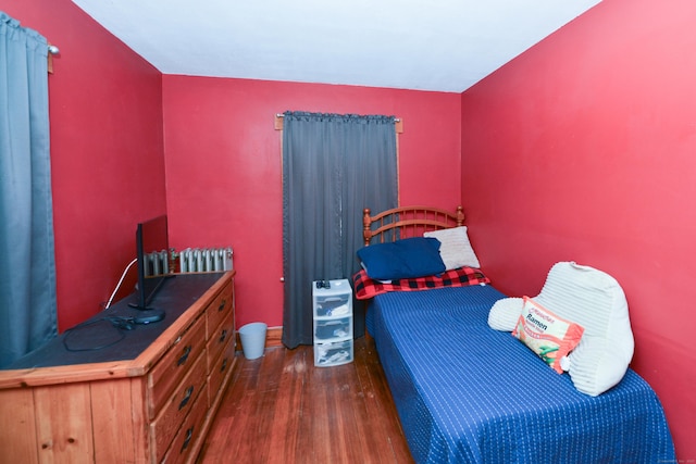 bedroom featuring wood finished floors