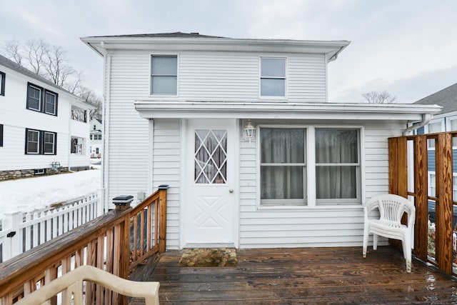 exterior space with a deck and fence