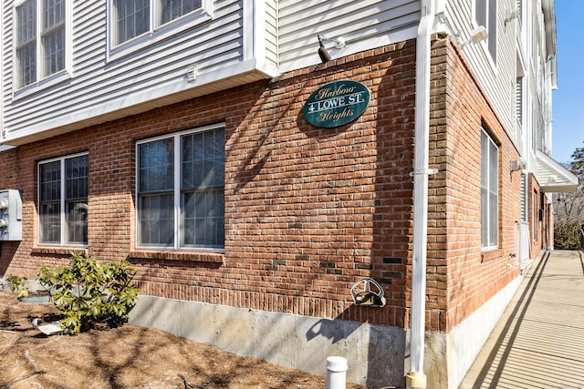 view of home's exterior with brick siding