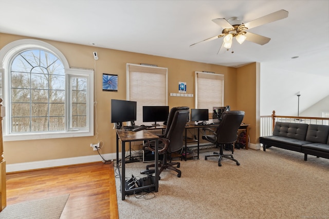 office featuring ceiling fan, baseboards, and wood finished floors