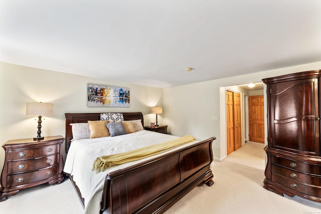 bedroom featuring baseboards and light colored carpet