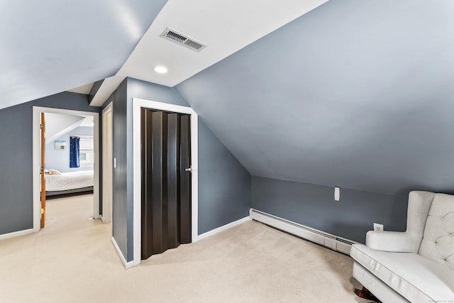 bonus room featuring carpet floors, baseboards, visible vents, and baseboard heating