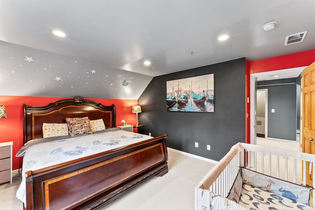 carpeted bedroom with lofted ceiling, visible vents, baseboards, and recessed lighting