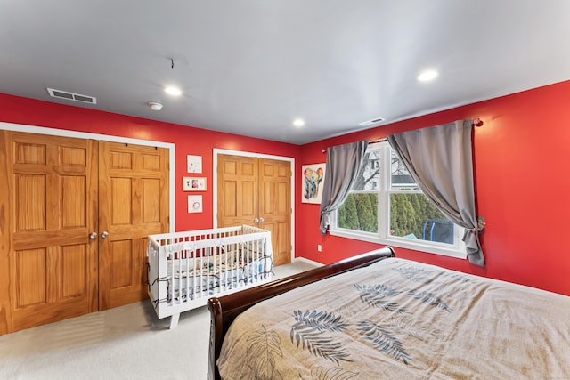 bedroom featuring carpet floors, recessed lighting, and visible vents