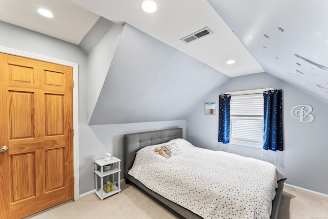 bedroom with carpet, visible vents, vaulted ceiling, and baseboards