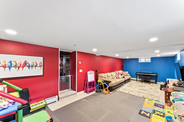 playroom with baseboards, baseboard heating, and recessed lighting