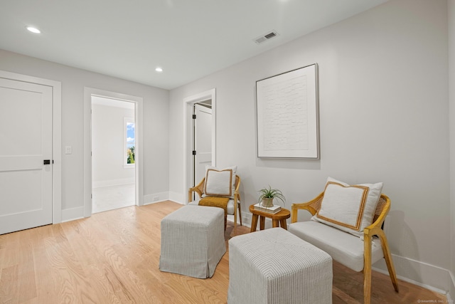 sitting room featuring recessed lighting, visible vents, light wood-style flooring, and baseboards