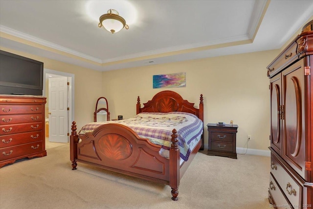 bedroom with light carpet, baseboards, a raised ceiling, and crown molding