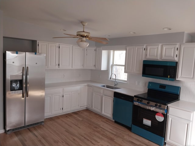 kitchen with range with electric stovetop, a sink, light countertops, stainless steel refrigerator with ice dispenser, and dishwasher