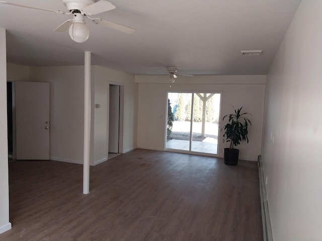 empty room with visible vents, baseboard heating, a ceiling fan, wood finished floors, and baseboards