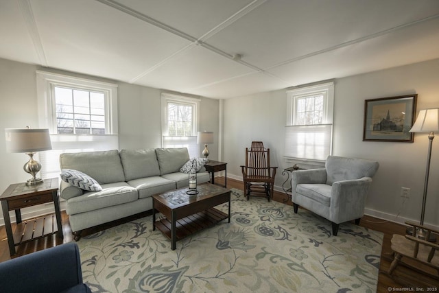 living area with light wood-type flooring and baseboards