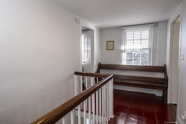 hallway featuring hardwood / wood-style flooring and an upstairs landing