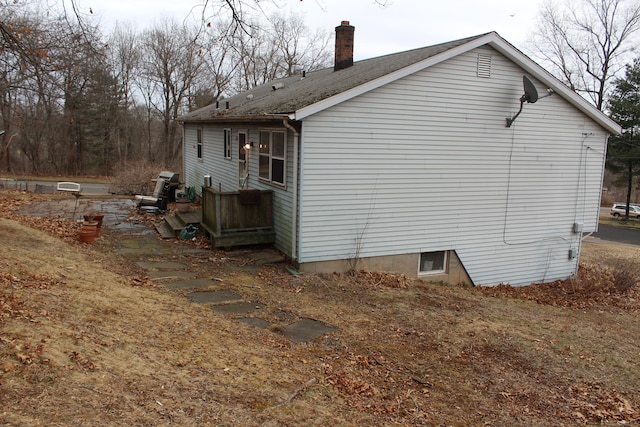 view of side of property featuring a chimney