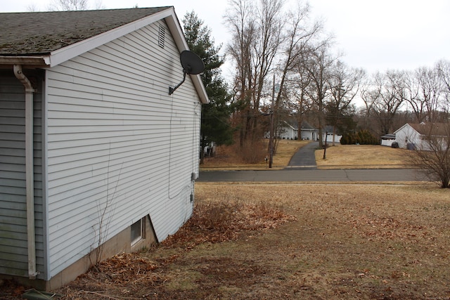 view of home's exterior featuring a shingled roof