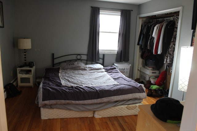 bedroom with a closet and wood finished floors