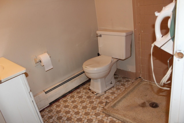 bathroom featuring toilet, a baseboard radiator, and vanity