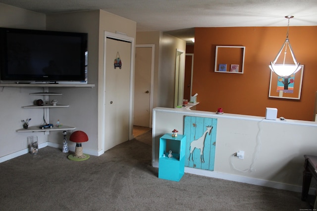 interior space featuring carpet and baseboards