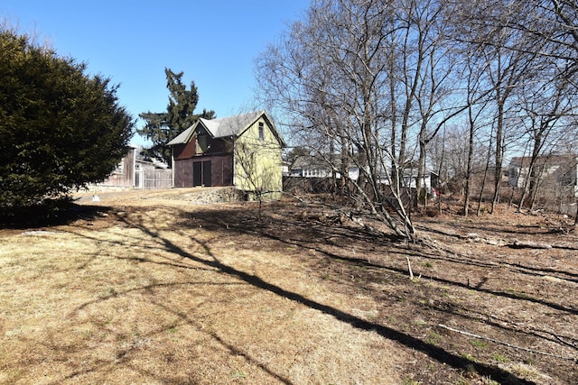 view of property exterior with fence