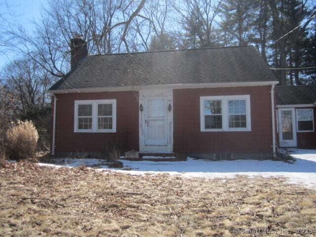 view of front of property with a chimney