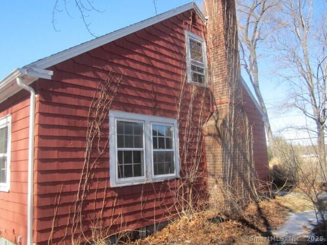 view of home's exterior featuring a chimney